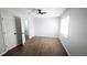 Bright bedroom featuring wood-look flooring and a ceiling fan at 5582 Windwood Rd, Atlanta, GA 30349