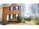 Two-story brick home with black shutters and a well-maintained lawn at 5582 Windwood Rd, Atlanta, GA 30349