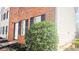 A view of the side of a home with brick and siding and manicured landscaping at 5582 Windwood Rd, Atlanta, GA 30349