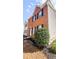 A view of the side of a home with brick and siding and manicured landscaping at 5582 Windwood Rd, Atlanta, GA 30349