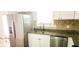 Updated kitchen features stainless steel appliances, granite counters, and stylish backsplash at 5582 Windwood Rd, Atlanta, GA 30349