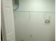 A utilitarian laundry room with white wire shelving and access to utilities at 5582 Windwood Rd, Atlanta, GA 30349