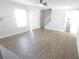 Living room with wood-look flooring and abundant natural light at 5582 Windwood Rd, Atlanta, GA 30349
