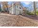 Lovely backyard view of a well-maintained house with a deck and attached garage at 5916 Simone Dr, Stone Mountain, GA 30087