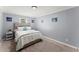 Comfortable bedroom featuring a double bed, neutral décor, and ample wall art at 5916 Simone Dr, Stone Mountain, GA 30087