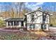 Charming two-story home featuring a neatly maintained yard with a stone walkway leading to the front door at 5916 Simone Dr, Stone Mountain, GA 30087