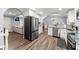 Modern kitchen featuring stainless steel appliances, granite countertops, and hardwood flooring at 5916 Simone Dr, Stone Mountain, GA 30087