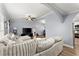 Open-concept living room with hardwood floors, a large sectional sofa, and a view into the kitchen and dining area at 5916 Simone Dr, Stone Mountain, GA 30087