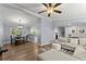 Open living area showcases hardwood floors, a comfortable sectional sofa, and seamless transition to the dining area at 5916 Simone Dr, Stone Mountain, GA 30087