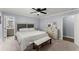 Bright main bedroom featuring a bed, dresser, and ensuite bathroom at 5916 Simone Dr, Stone Mountain, GA 30087