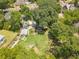 Expansive aerial view of the property, revealing a lush lawn, greenhouse, and manicured gardens at 1000 Nw Main St, Conyers, GA 30012