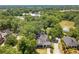 Spacious wooded lot features a charming home and lovely garden creating a beautiful outdoor space at 1000 Nw Main St, Conyers, GA 30012