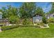 Backyard with garden, lush lawn, and wood fence at 1000 Nw Main St, Conyers, GA 30012