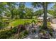 Spacious backyard with lush greenery, water feature, and a charming detached building at 1000 Nw Main St, Conyers, GA 30012