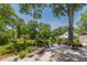 Inviting outdoor patio with lounge chairs and dining set surrounded by lush landscaping at 1000 Nw Main St, Conyers, GA 30012