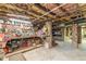 Unfinished basement with exposed brick and wooden beams offers potential for customization at 1000 Nw Main St, Conyers, GA 30012