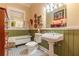 Charming bathroom with pedestal sink, clawfoot tub, and black and white tile floor at 1000 Nw Main St, Conyers, GA 30012