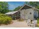 Charming detached building with brick pathway and unique decorative touches around the exterior at 1000 Nw Main St, Conyers, GA 30012
