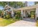 Charming home featuring a carport, well-maintained lawn, and inviting front porch with colorful decor at 1000 Nw Main St, Conyers, GA 30012