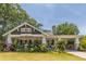Charming bungalow featuring a landscaped yard, inviting front porch and convenient covered carport at 1000 Nw Main St, Conyers, GA 30012