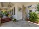 Inviting front porch with stained glass windows and colorful seating, offers a perfect relaxation spot at 1000 Nw Main St, Conyers, GA 30012