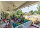 Inviting front porch features swing, rocking chairs, ceiling fan, and charming details for relaxing outdoor living at 1000 Nw Main St, Conyers, GA 30012