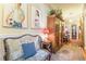 Spacious hallway with vintage furnishings, artwork, and view into other rooms at 1000 Nw Main St, Conyers, GA 30012