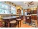 Open kitchen with wood cabinets, granite counters, butcher block island and hardwood floors at 1000 Nw Main St, Conyers, GA 30012