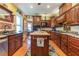 Cozy kitchen with custom wood cabinets, granite countertops, a center island, and stainless steel appliances at 1000 Nw Main St, Conyers, GA 30012