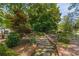 Scenic stone pathway surrounded by lush landscaping, inviting a tranquil exploration of the grounds at 1000 Nw Main St, Conyers, GA 30012