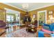 Open concept living room with hardwood floors, chandelier lighting, and views to dining room at 1000 Nw Main St, Conyers, GA 30012