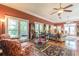 Bright living room featuring hardwood floors, large windows, and comfortable seating arrangements at 1000 Nw Main St, Conyers, GA 30012