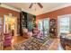 Comfortable living area showcasing hardwood floors, multiple windows, and classic decor at 1000 Nw Main St, Conyers, GA 30012