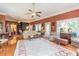Spacious living area with hardwood floors, elegant furnishings, and abundant natural light from large windows at 1000 Nw Main St, Conyers, GA 30012