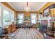 Bright living room featuring fireplace, chandelier, and large windows at 1000 Nw Main St, Conyers, GA 30012