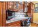 Built in cherry wood office space with granite countertops and matching cabinets at 1000 Nw Main St, Conyers, GA 30012