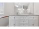 Bathroom with a large mirror over a dual sink vanity and tile flooring at 108 Kelly Ct, Dallas, GA 30157