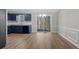 Open dining area with wood floors and sliding glass doors, seamlessly connected to the kitchen space at 108 Kelly Ct, Dallas, GA 30157