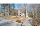 Inviting home with a long driveway, set amongst mature trees, offering a sense of privacy and tranquility at 108 Kelly Ct, Dallas, GA 30157