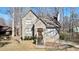 Charming home featuring a welcoming front porch and classic architectural details, nestled in a wooded setting at 108 Kelly Ct, Dallas, GA 30157