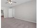 Large primary bedroom with neutral walls and carpet flooring, plus dual closets at 108 Kelly Ct, Dallas, GA 30157