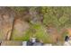 An overhead view of the backyard, featuring trees and grassy areas at 127 Hyde Way, Dallas, GA 30157