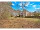 Large backyard with mature trees offers privacy and space for outdoor enjoyment at 127 Hyde Way, Dallas, GA 30157