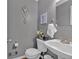 Well-decorated bathroom with a modern sink, toilet, and stylish wall art at 127 Hyde Way, Dallas, GA 30157