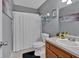 Clean bathroom featuring a shower, toilet, and vanity with fun accessories at 127 Hyde Way, Dallas, GA 30157