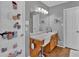 Bright bathroom with vanity, large mirror, and convenient shoe organizer on door at 127 Hyde Way, Dallas, GA 30157