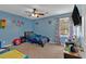 Vibrant bedroom with a race car theme, custom wall art, and natural light at 127 Hyde Way, Dallas, GA 30157