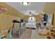 Cozy bedroom with a playpen, large sofa, and soft natural light at 127 Hyde Way, Dallas, GA 30157
