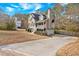 Charming two-story home boasts an inviting front porch and a three-car garage at 127 Hyde Way, Dallas, GA 30157