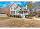 Beautiful two-story home with a well-manicured lawn and attractive landscaping at 127 Hyde Way, Dallas, GA 30157